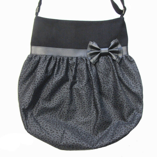 fourre-tout bandoulière avec noeud en cuirette noir et motif léopard noir et gris