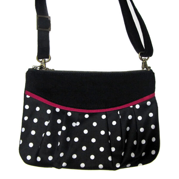 sac multifonction noir à pois blanc avec biais rose