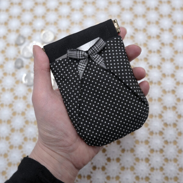 black card holder with flex frame and tiny polka dots